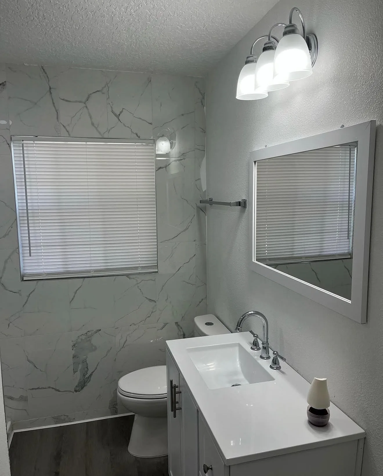 Chrome & Marble Bathroom Remodel — Bathroom Tile Installation in Central Florida