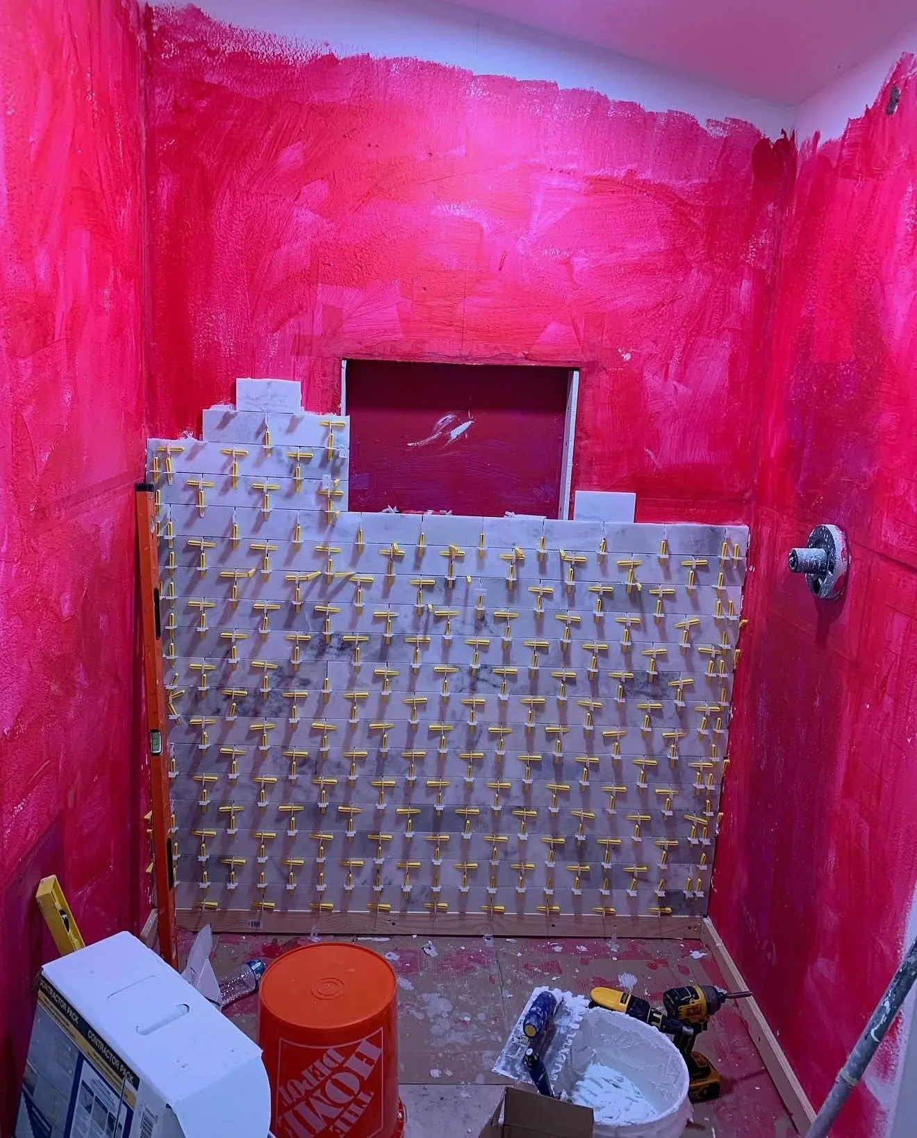 Marble subway tile shower niche framed and waterproofed before grouting