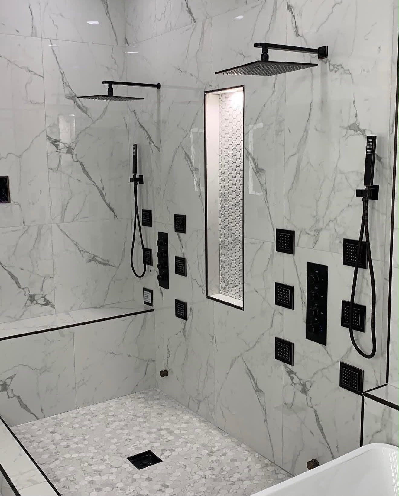 Built-in linen tower cabinet between the double vanity mirrors